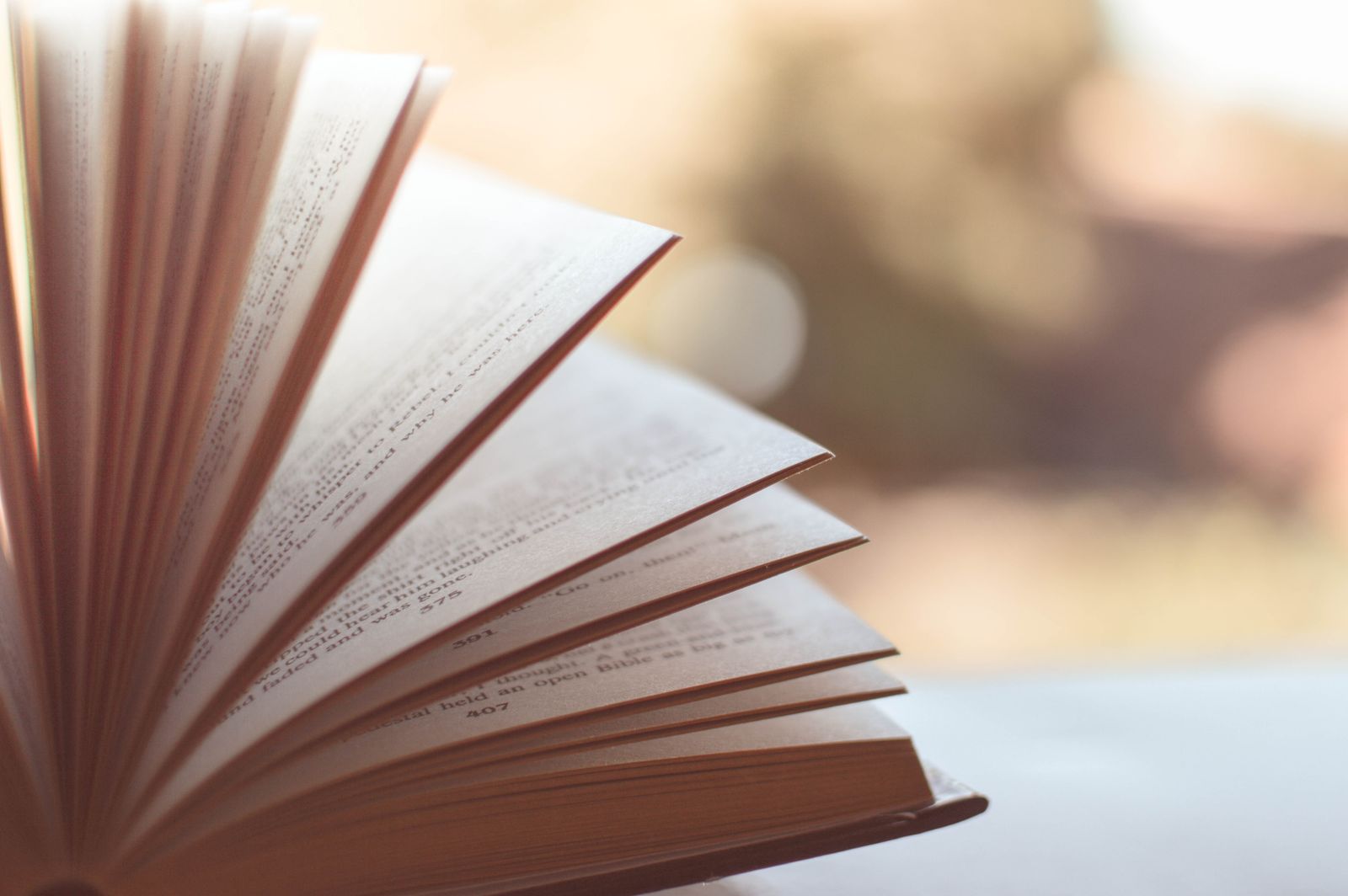 An ancient leather-bound handbook on cream linen, representing the Enchiridion of Epictetus